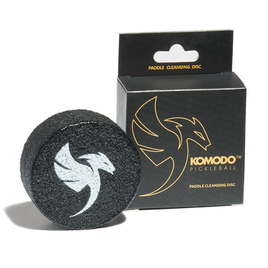 Komodo pickleball paddle cleansing disc with packaging on a white background