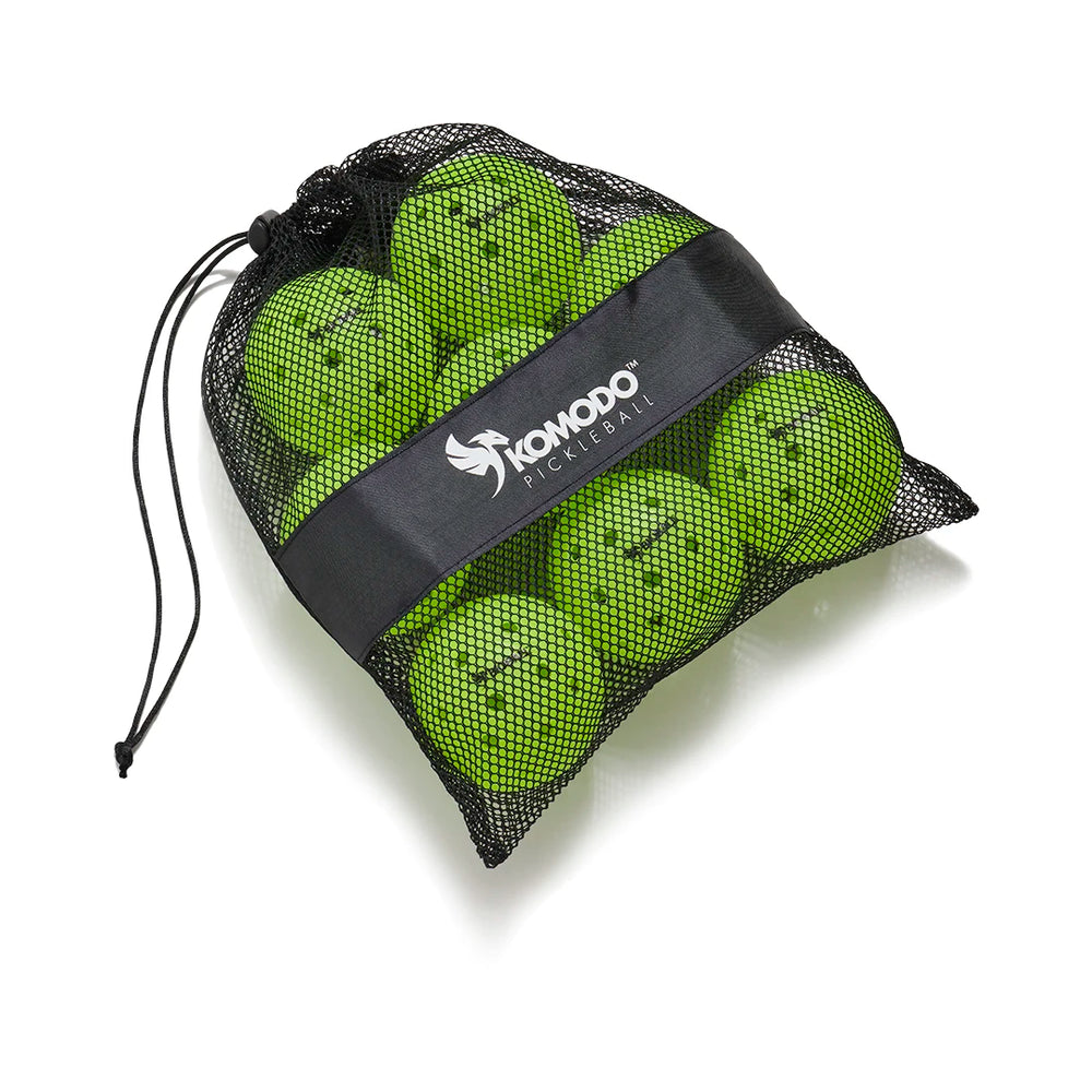 Bag of green Bioball pickleballs with a black drawstring and visible brand Komodo logo on a white background