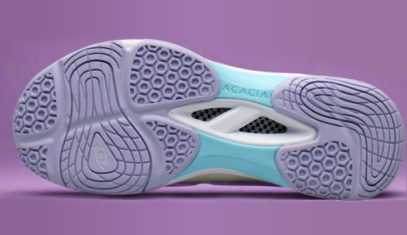 Dreamshot close-up of the sole of a pickleball shoe with 'Acacia' branding on a purple background