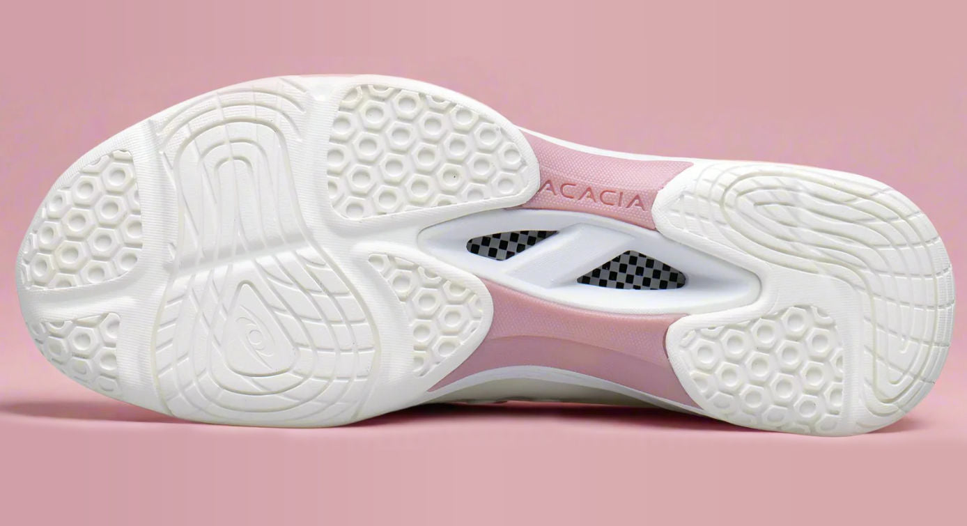 White pickleball shoe sole with Acacia brand name on a pink background