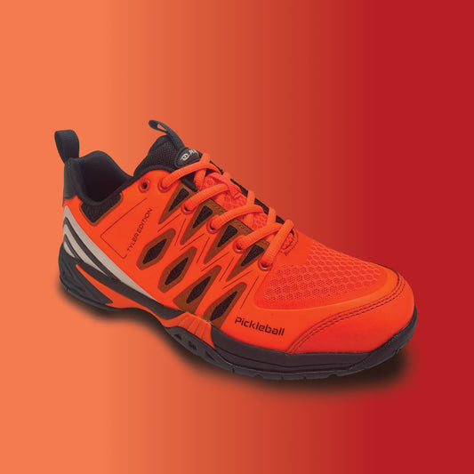 Pickleball shoe, Orange pickleball shoe with black accents on a red background
