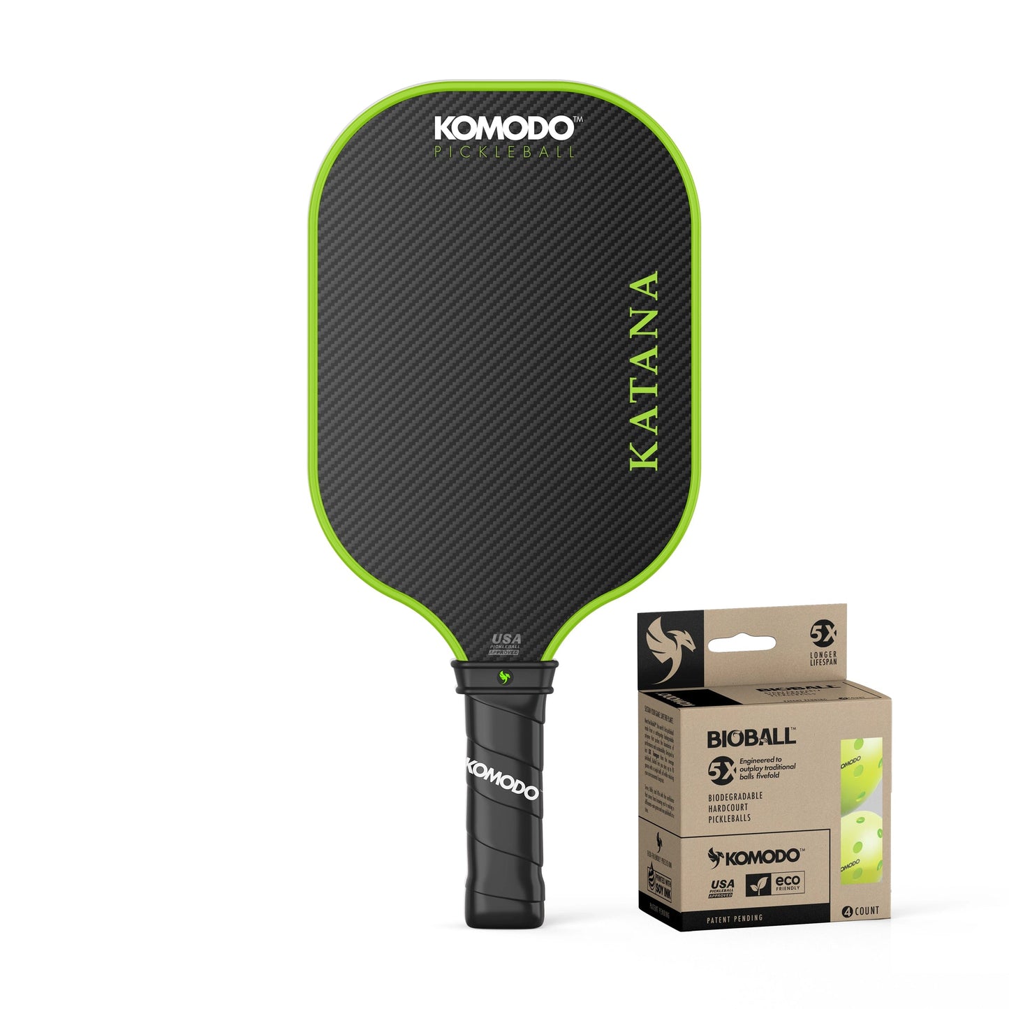 Black and green pickleball paddle with 'Komodo' branding and 4 pack of Bioball pickleballs on a white background