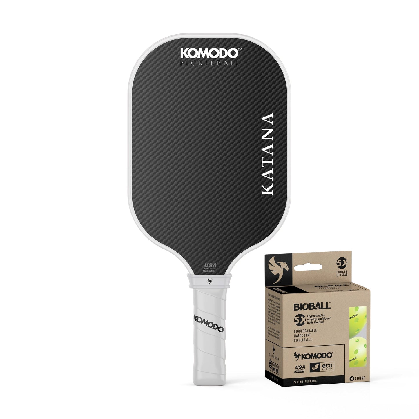 Komodo 16mm white & black Katana pickleball paddle with a 4 pack Bioball packaging on a white background